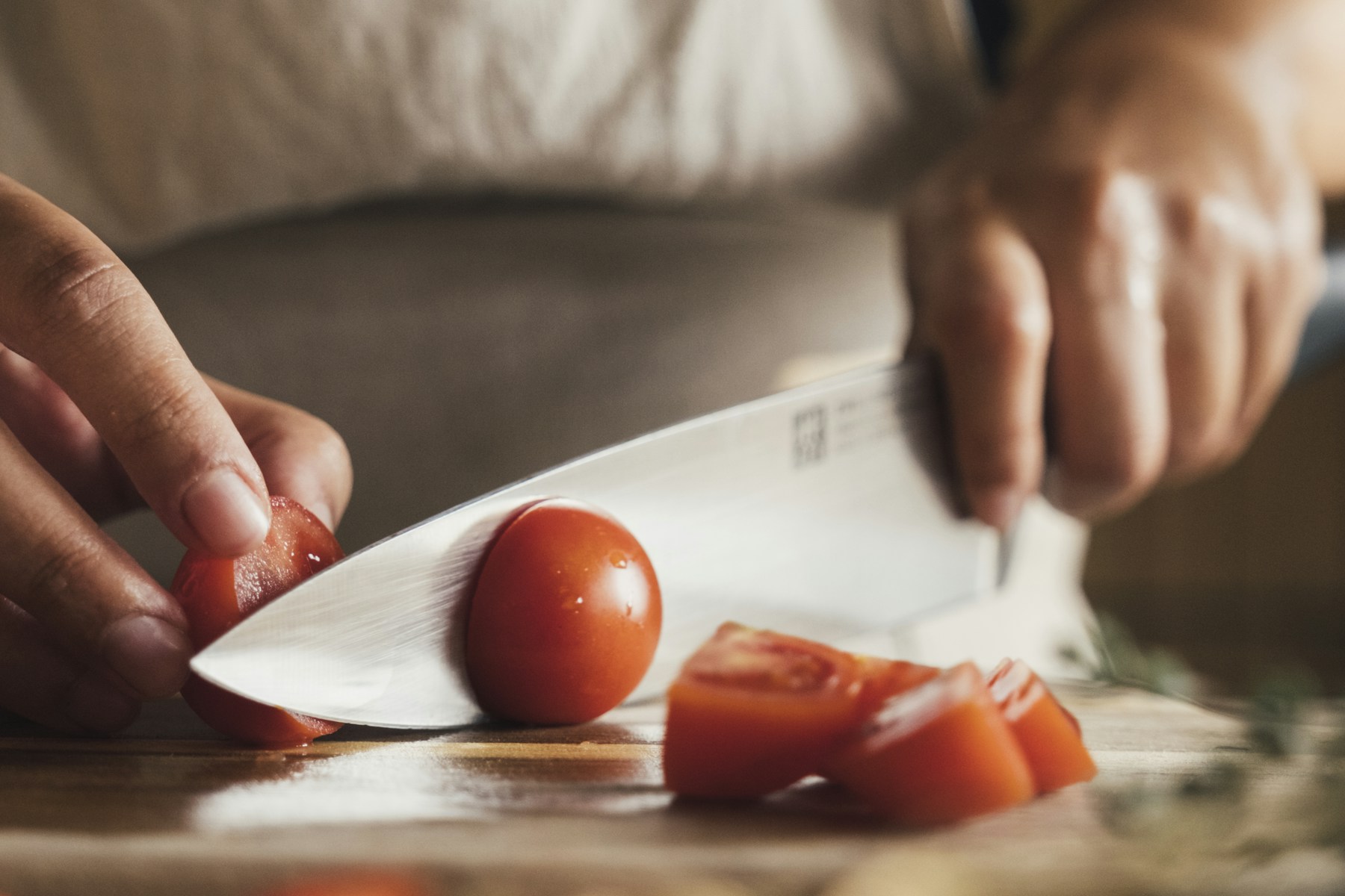 Fresh tomatoes being carefully prepared